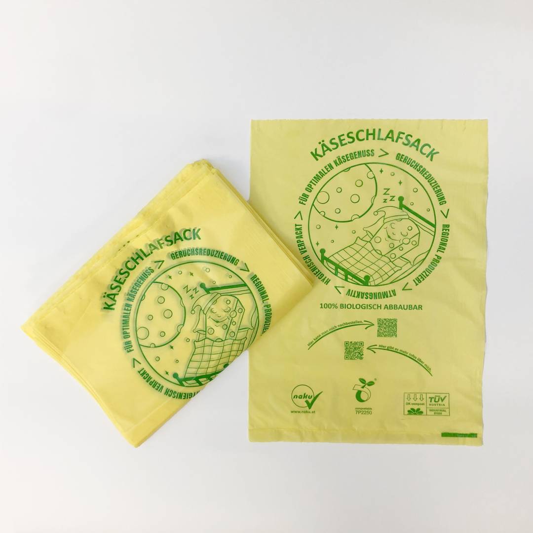 Naku Käseschlafsack - Käsebeutel aus Maisstärke 100er Pack für die Käsetheke Einzelbild und Pack